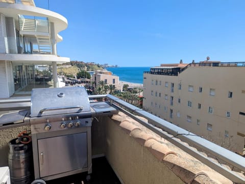 Gas BBQ on the upper terrace with the sea behind