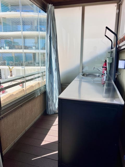 Outdoor kitchenette with sink on the terrace
