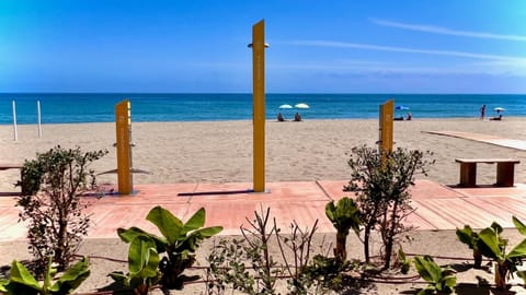 Beach showers on the boardwalk at Carvajal beach